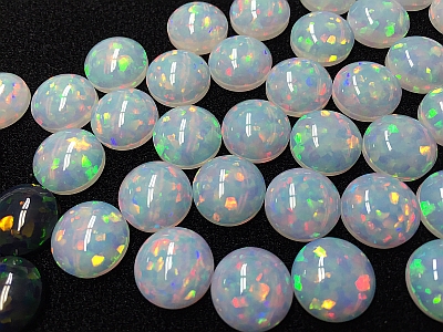 White and black synthetic impregnated opals (cut opals)